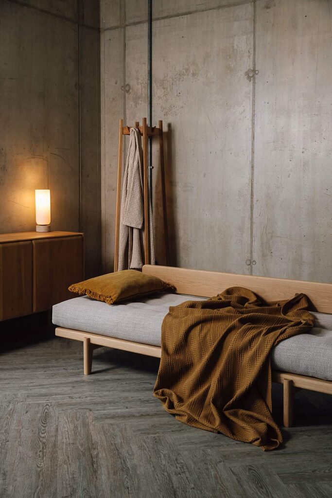 Oak Osaka daybed with mustard cushion and throw.