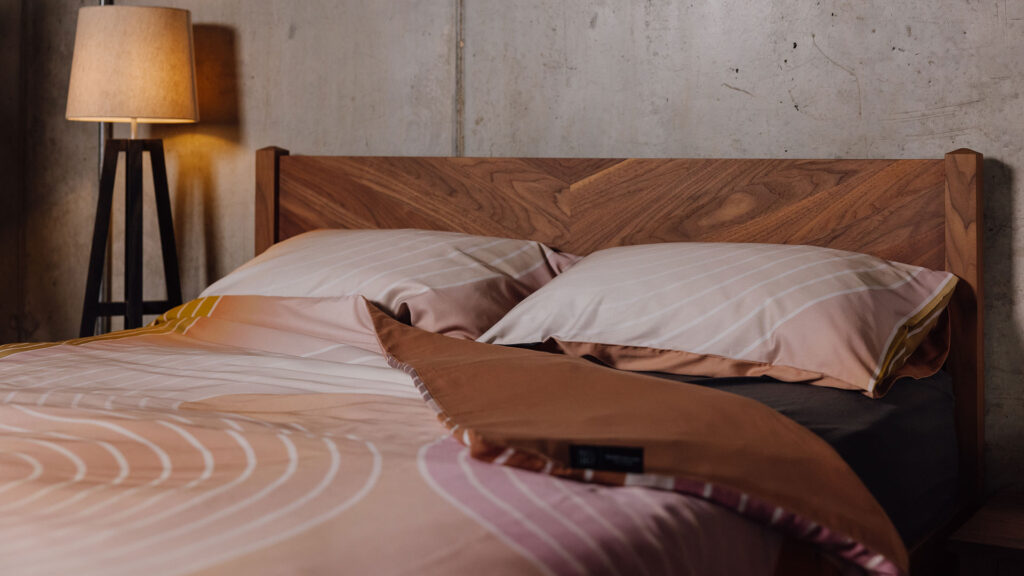 reversible organic cotton duvet set on walnut Dalston bed
