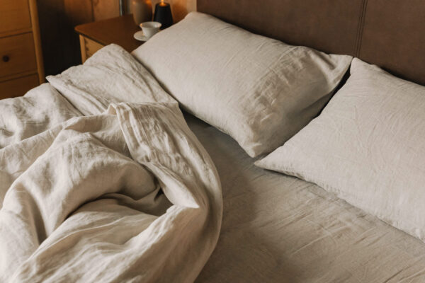 rumpled linen bedding in ecru