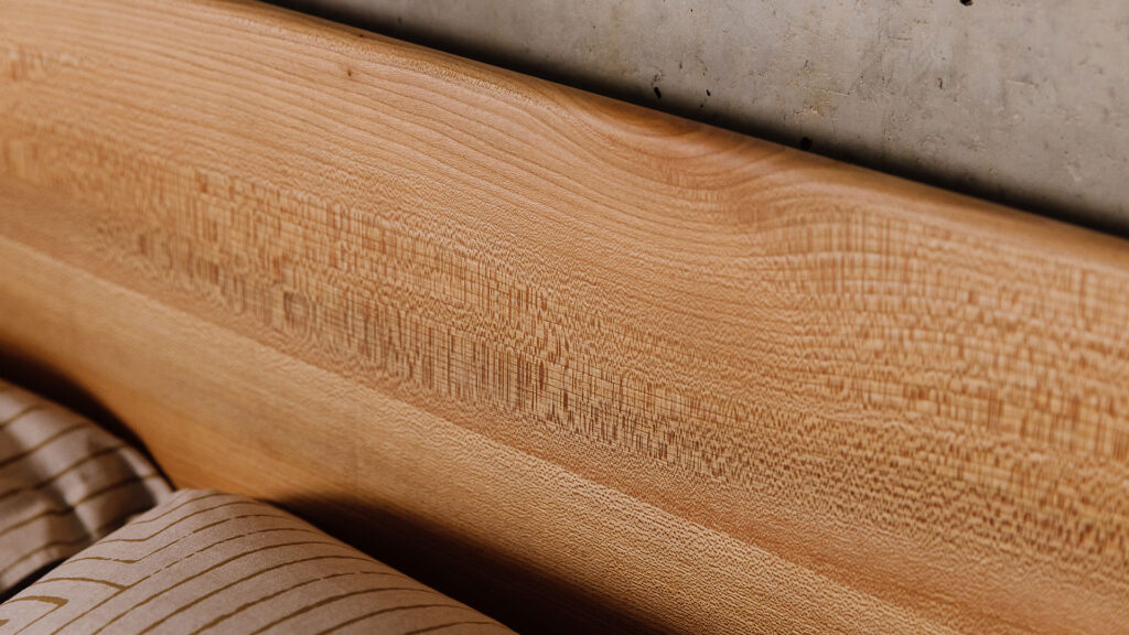 Detail on Scottish Elm Camden headboard. Bed from Natural Bed Company showing real timber detail.