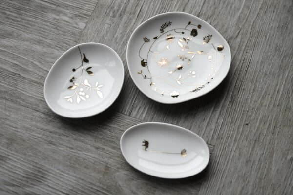 set of small dishes with gold decoration