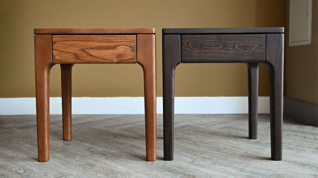 Tall Camden Drawer Tables in two different finishes, showing warm smoked and cool smoked ash. Photographed against a pale beige wall.