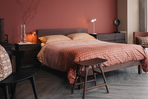 smoked finish walnut bedroom furniture with ombre tencel bedding in rust