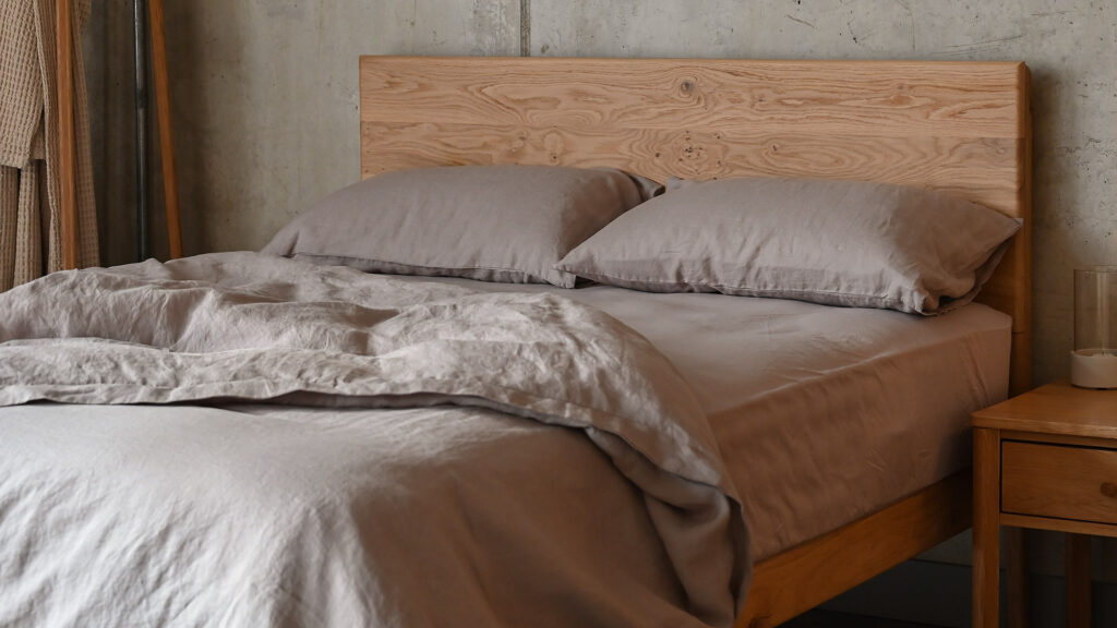 Rumpled linen bedding on English Oak Chiswick bed, in the colour Mocha.