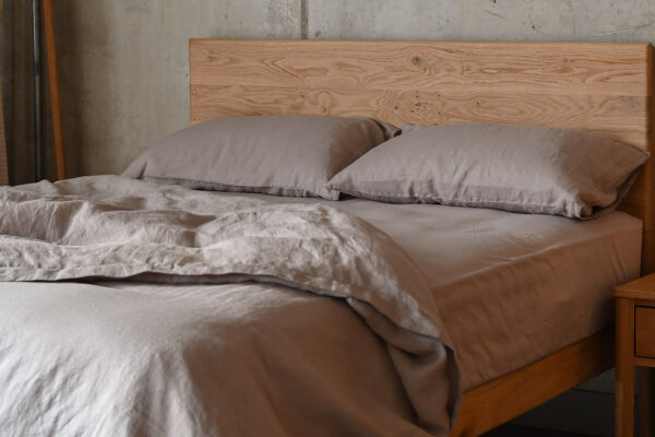 Rumpled linen bedding on English Oak Chiswick bed, in the colour Mocha.