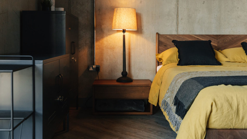 tall turned lamp on low cube table with walnut hoxton