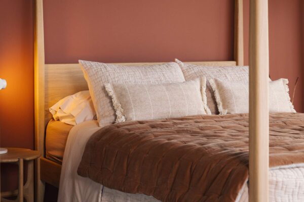 textured blush bedding with cinnamon quilt