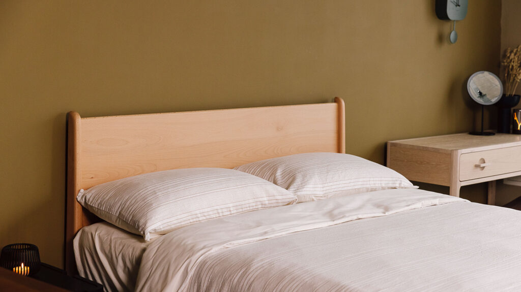 Beech Camden bed with textured cotton duvet set. Simply dressed.