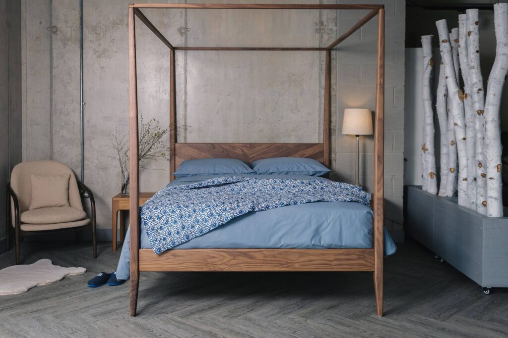 walnut 4 poster Harrow with blue bedding 1