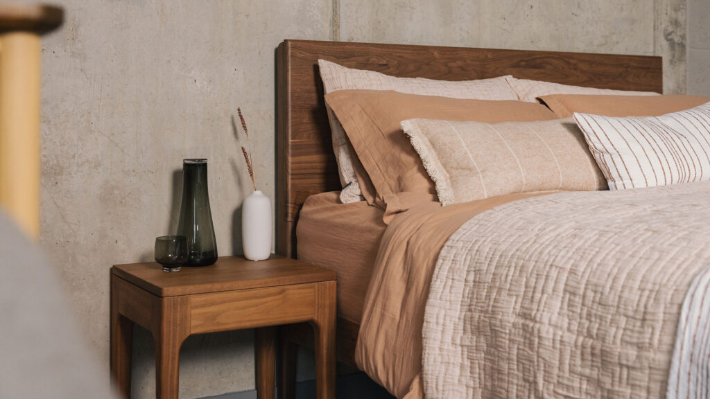 walnut camden bedside table with walnut chiswick bed, styled with blush bedding.