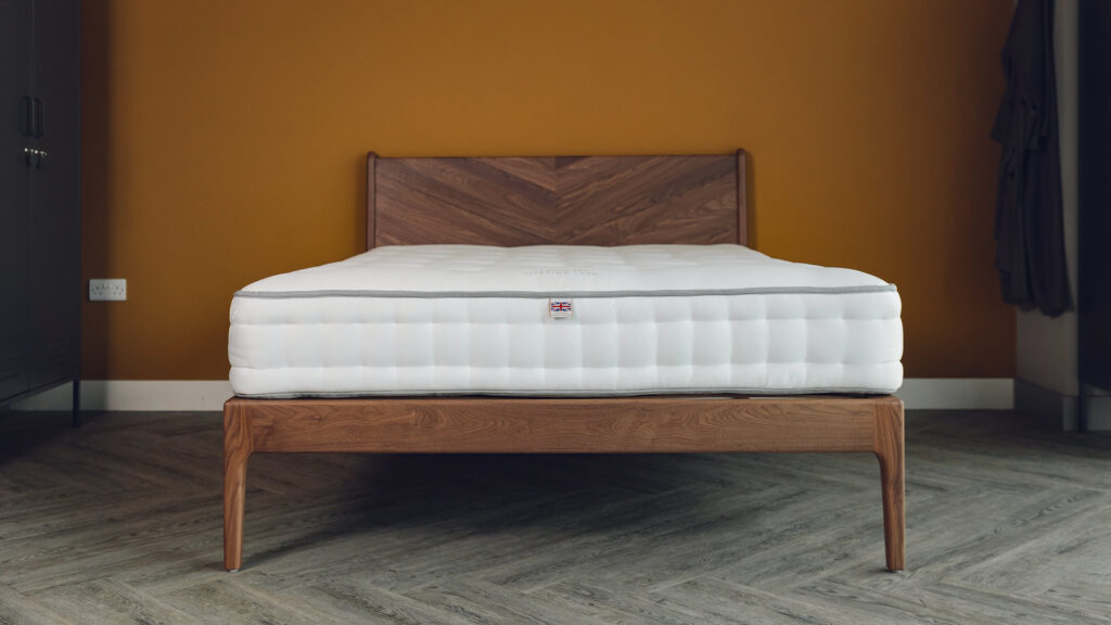 walnut hoxton bed with chevron headboard front