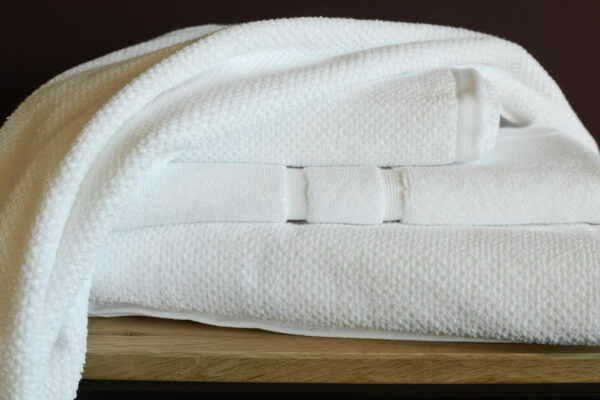 white cotton towels bath mats stack2