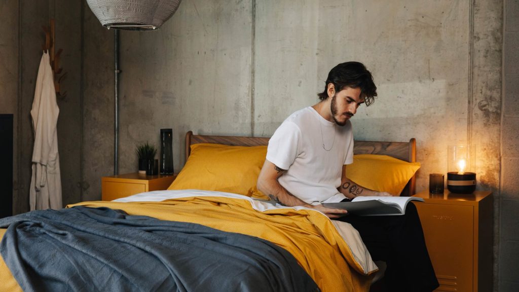 yellow and grey bedding on hoxton model