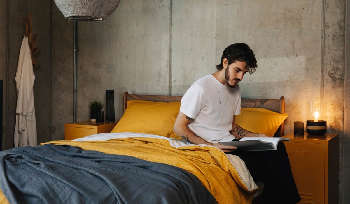 yellow and grey bedding on hoxton model