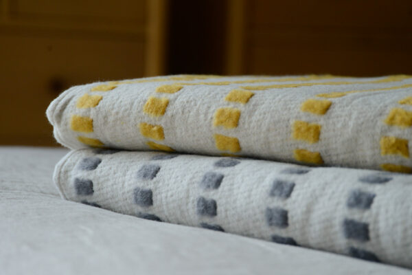 yellow or grey modern patterned throws